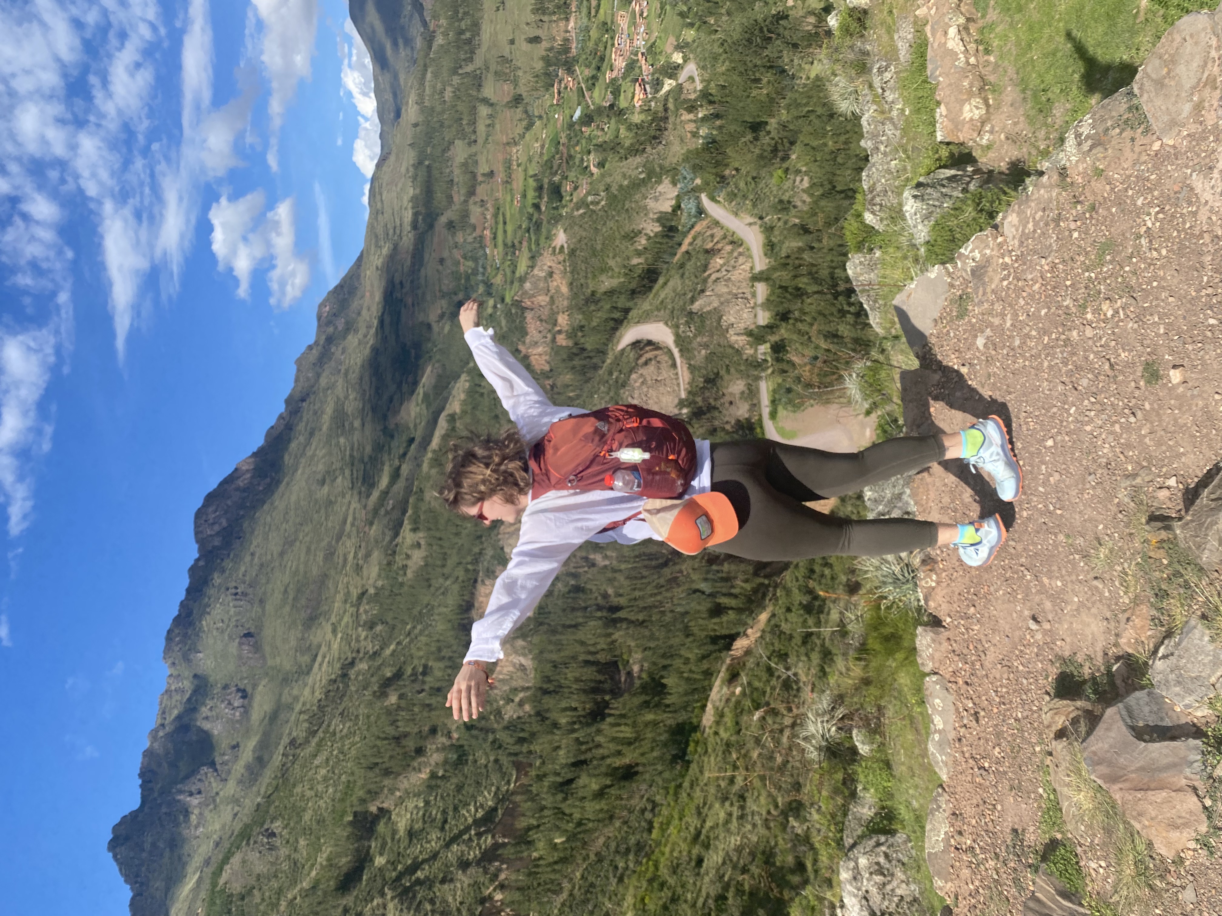 Me enjoying the winds whipping through the mountains in the Inkan ruins of Pisac, Peru